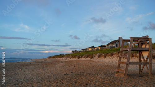 Morning dawn at the beach with homes and seagrass