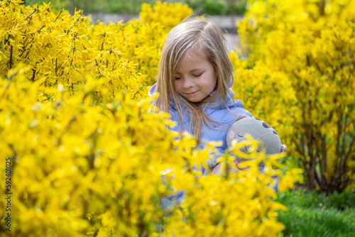 little girl in a field of dandelions