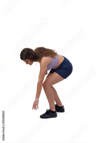 young girl who picks up something from the ground on white background