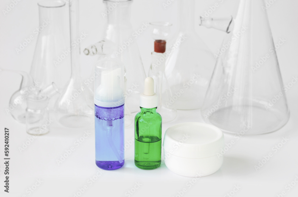 skin serum, moisturizing and whitening serum, fruit acids.Glass Volumetric Flask ,Laboratory Flasksare used for laboratory work in the background skin serum, moisturizing and whitening serum, fruit acids.Glass Volumetric Flask ,Laboratory Flasksare used for laboratory work in the background