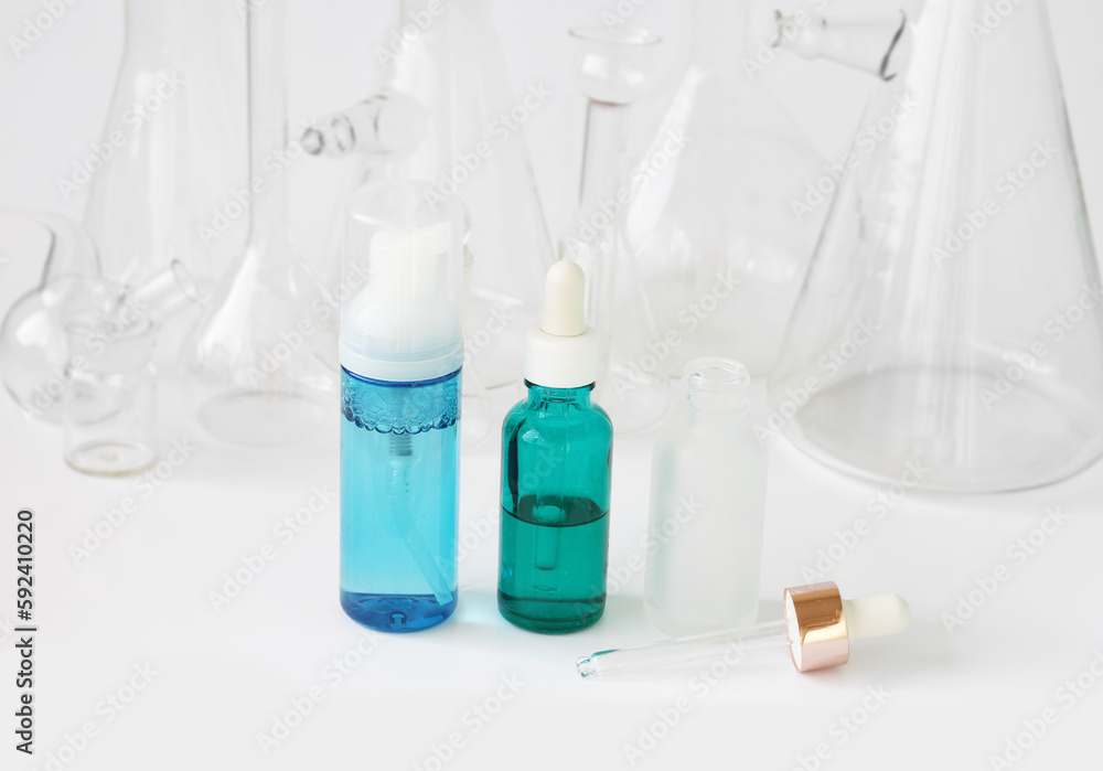 skin serum, moisturizing and whitening serum, fruit acids.Glass Volumetric Flask ,Laboratory Flasksare used for laboratory work in the background skin serum, moisturizing and whitening serum, fruit acids.Glass Volumetric Flask ,Laboratory Flasksare used for laboratory work in the background
