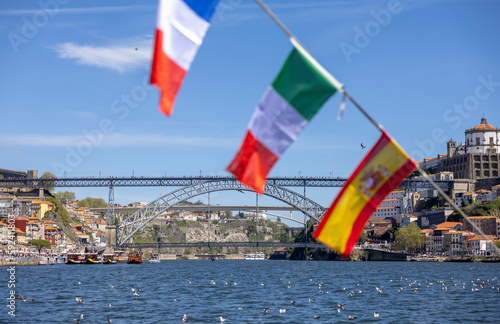 Ribeira bridge (D. Luis I) over Douro river with lots of seagulls. Porto, Portugal.