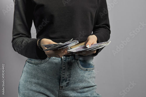 Euro banknotes in the hands of a girl
