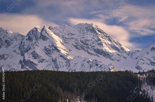 Beautiful early spring mountain landscape. View of the snow-white peaks in the Polish Tatra Mountains.
