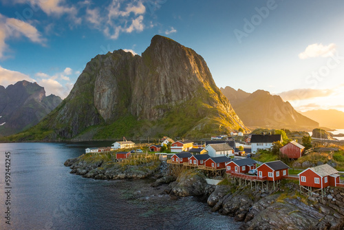 Beautiful sunrise over Hamnoy, fishermen village with the typical red houses of the Lofoten Islands , Norway photo