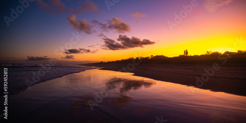 Beautiful colorful sunset on wild Patchs beach near Byron Bay. Hiddem gems of NSW, Australia