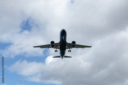 Landing of a passenger plane against the sky