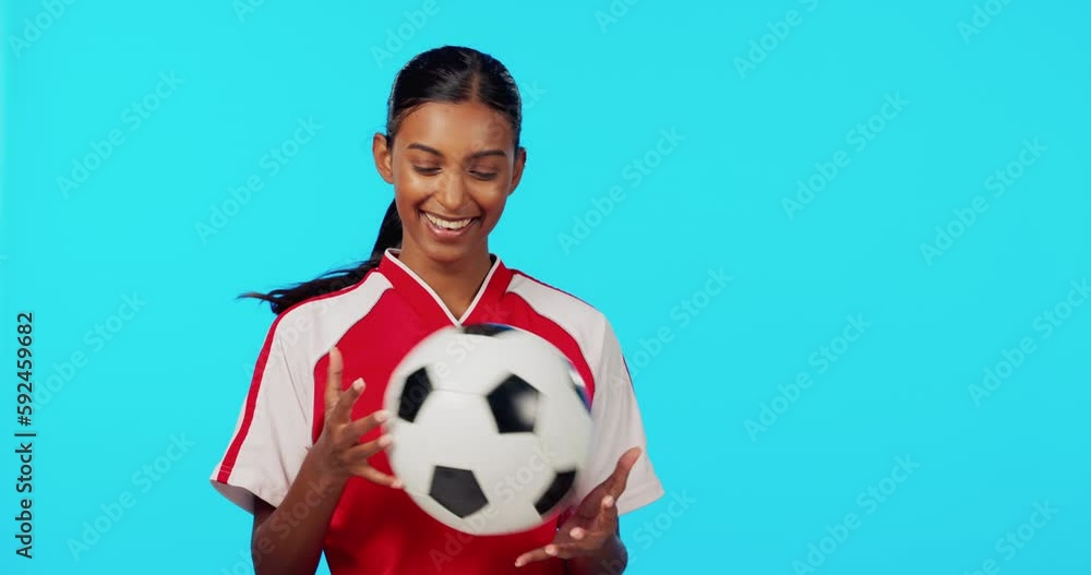 Sports, playful and soccer with woman in studio for fitness, training or competition. Smile, workout and football with portrait of female athlete on blue background for games, motivation and match Sports, playful and soccer with woman in studio for fitness, training or competition. Smile, workout and football with portrait of female athlete on blue background for games, motivation and match