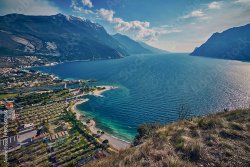 Panorama of Torbole a small town on Lake Garda, Italy. Europa.Beautiful Lake Garda surrounded by mountains in the spring time seen from Mount Brione