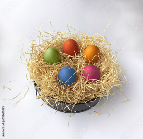Easter eggs in decorative straw