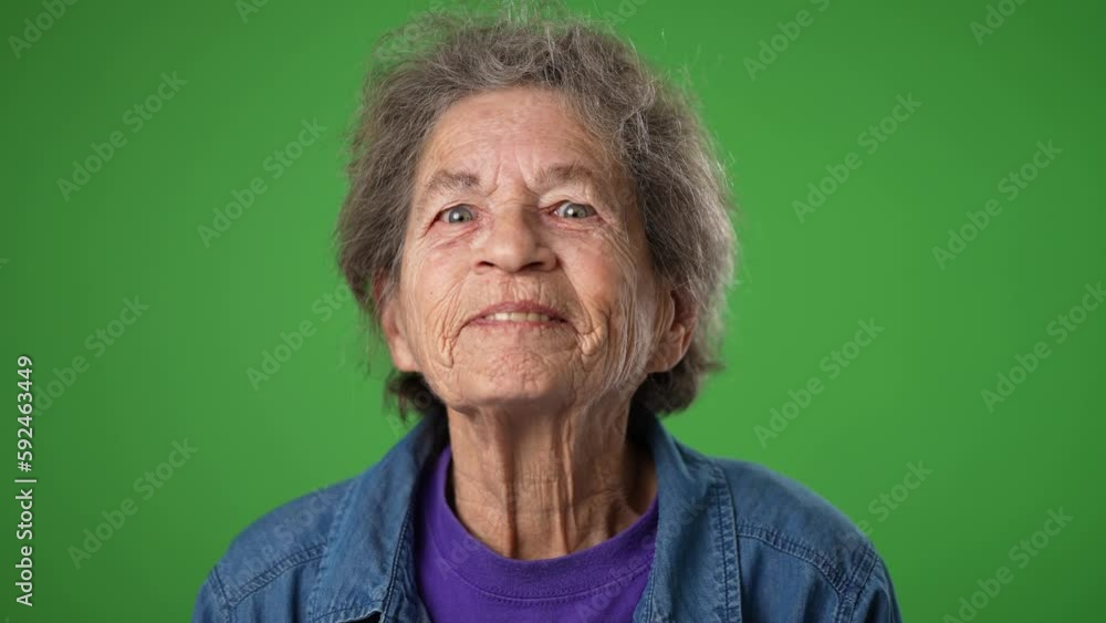 Closeup slow motion of dreaming, thinking thoughtful elderly old toothless woman with idea on green screen background. Closeup slow motion of dreaming, thinking thoughtful elderly old toothless woman with idea on green screen background.