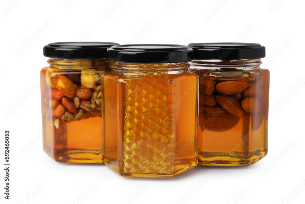 Jars with different nuts and honey on white background Jars with different nuts and honey on white background