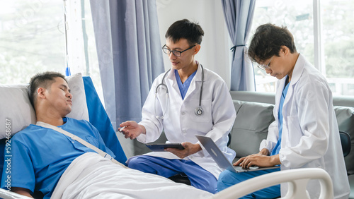 The medical team visits the car accident patients who are lying on the nursing bed and arm cast with wrapping nurse bandages splint to the arm.