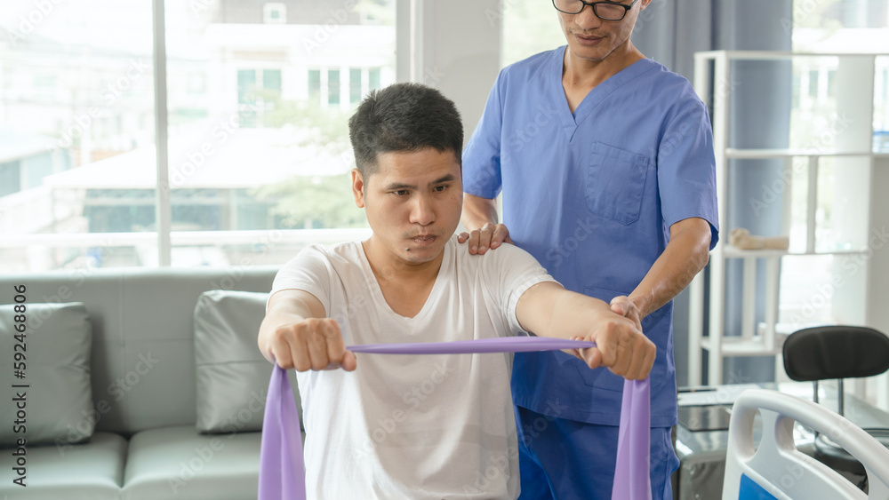 Obraz premium Athlete undergoing physiotherapy with a musculoskeletal specialist after sports and gym injuries.