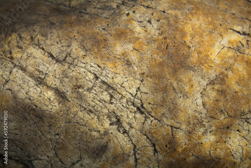 Stone background with orange and dark spots. Background, texture.