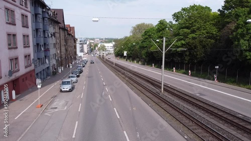 Aerial eye overhead top down view of cars driving on streets passing through