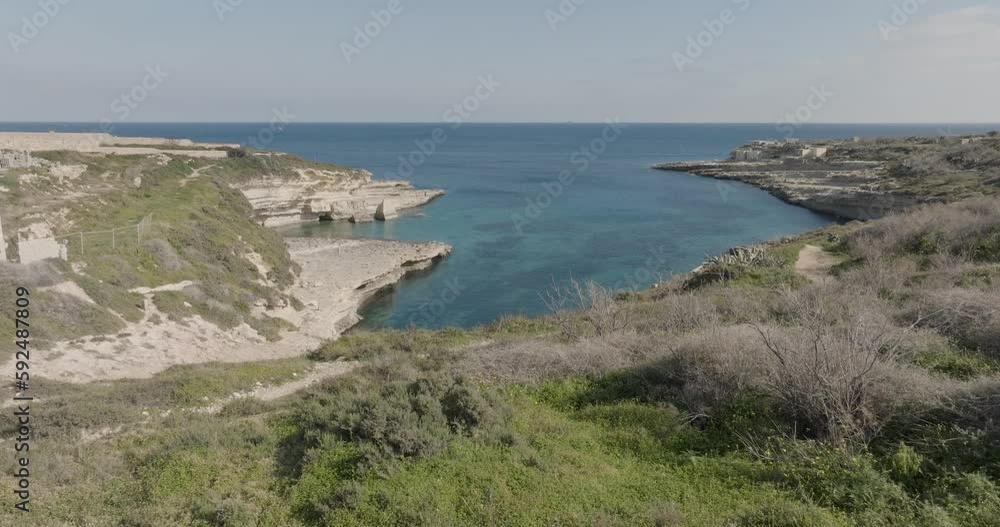 Aerial Drone shot over grass towards Kalanka Bay Malta Aerial Drone shot over grass towards Kalanka Bay Malta