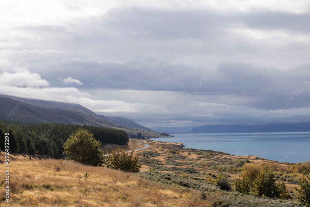 Landscape of a mountain lake, road, mountains. Beautiful landscape of New Zealand