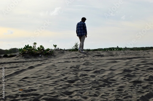 Yogyakarta, Indonesia – January 13, 2020: Amazing landscape Indonesia, Gumuk pasir or sand dune in Bantul with beautiful blue sky. Selected Focus