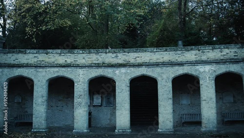 The archway entrance to a graveyard photo