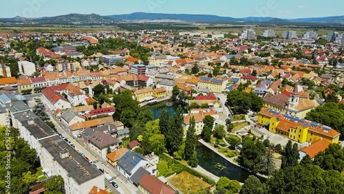 Aerial 4K drone footage of Tapolca. It is a town in Veszprém County, Hungary, close to Lake Balaton. The footage shows city center, the lake Malom and the watermill of Tapolca city. photo