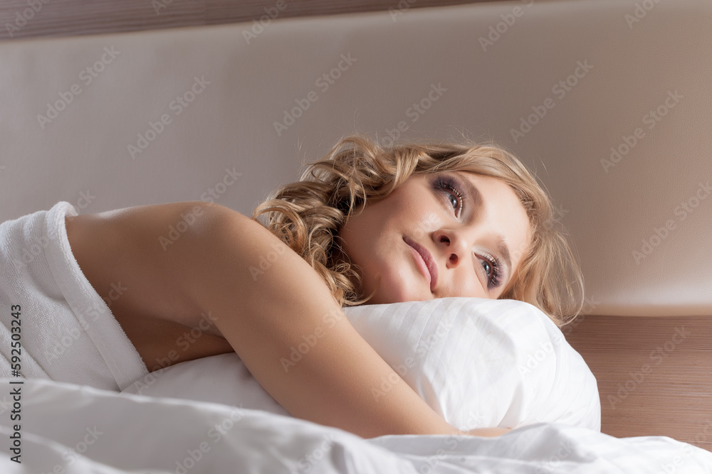 Portrait of lovely dreamy girl lying in bed Portrait of lovely dreamy girl lying in bed