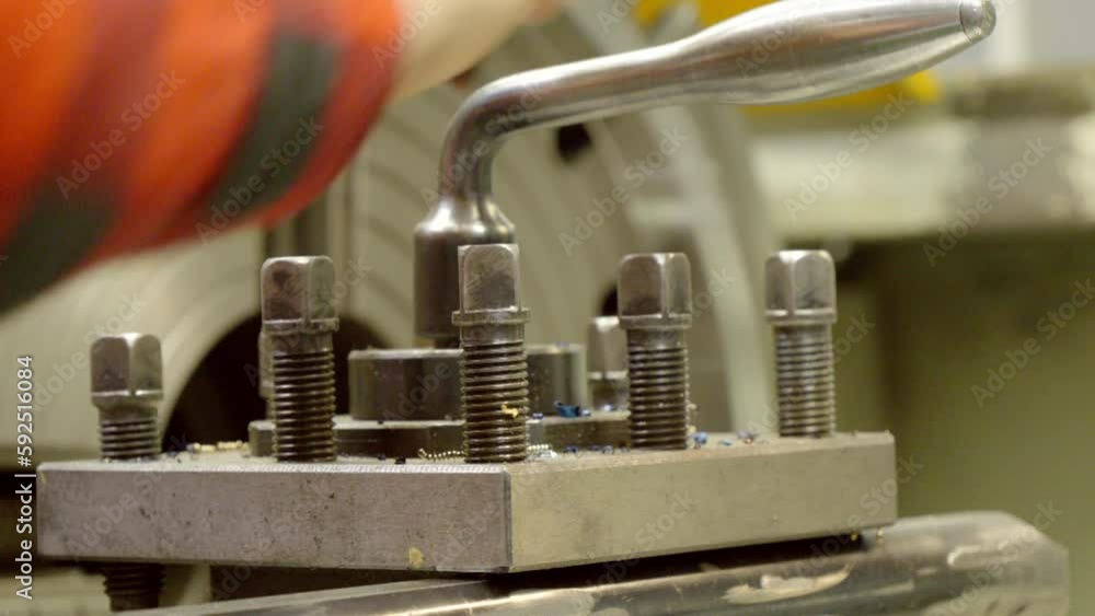 Lathe - mounting a tool post with a metal cutting tool. Lathe - mounting a tool post with a metal cutting tool.