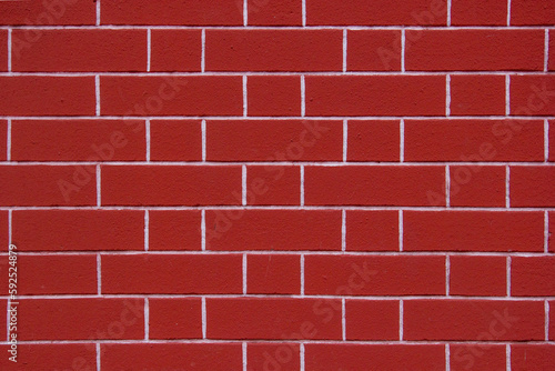 Texture of a bright red brick wall