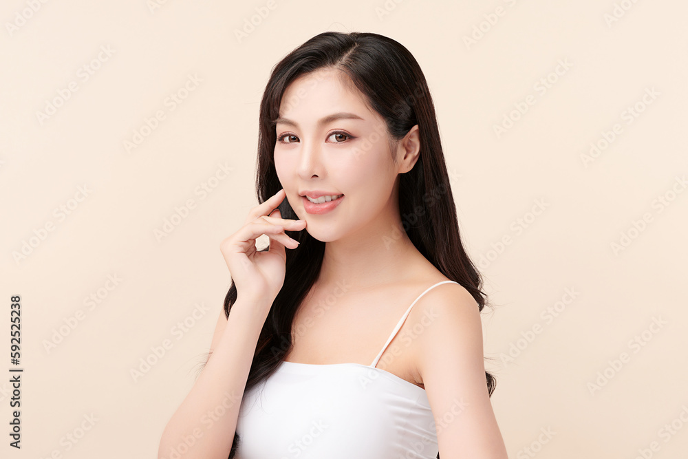 Beautiful young asian woman with clean fresh skin on beige background, Face care, Facial treatment, Cosmetology, beauty and spa, Asian women portrait. Beautiful young asian woman with clean fresh skin on beige background, Face care, Facial treatment, Cosmetology, beauty and spa, Asian women portrait.