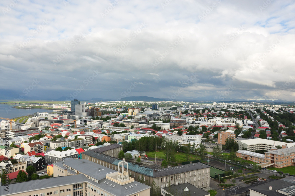 Aerial view of colorful buildings and lush greenery of Reykjavik, Iceland