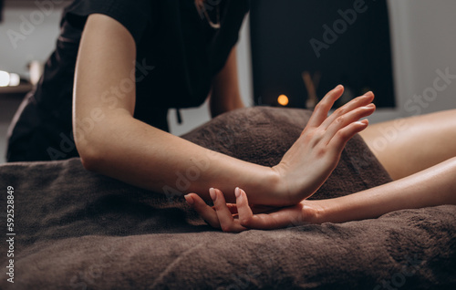 stroking massage of hands close up on a white background.