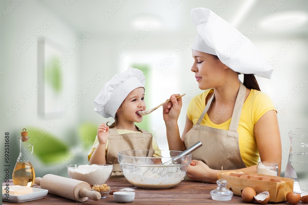Happy Family, young mother and child baker Happy Family, young mother and child baker