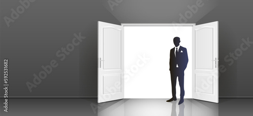 The interior of an empty dark room with an open door and the silhouette of a man in a suit.
Free up space for copying the 3d image.