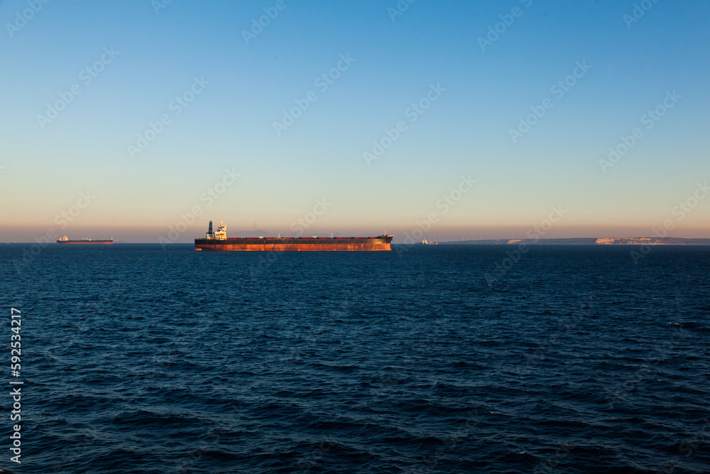 Bulk cargo ships are anchored in the bay of the seaport of Fos-sur-Mer in France. Bulk cargo ships are anchored in the bay of the seaport of Fos-sur-Mer in France.