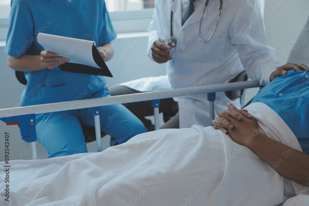 Injured patient showing doctor broken wrist and arm with bandage in hospital office or emergency room. Sprain, stress fracture or repetitive strain injury in hand. Nurse helping customer. First aid. Injured patient showing doctor broken wrist and arm with bandage in hospital office or emergency room. Sprain, stress fracture or repetitive strain injury in hand. Nurse helping customer. First aid.