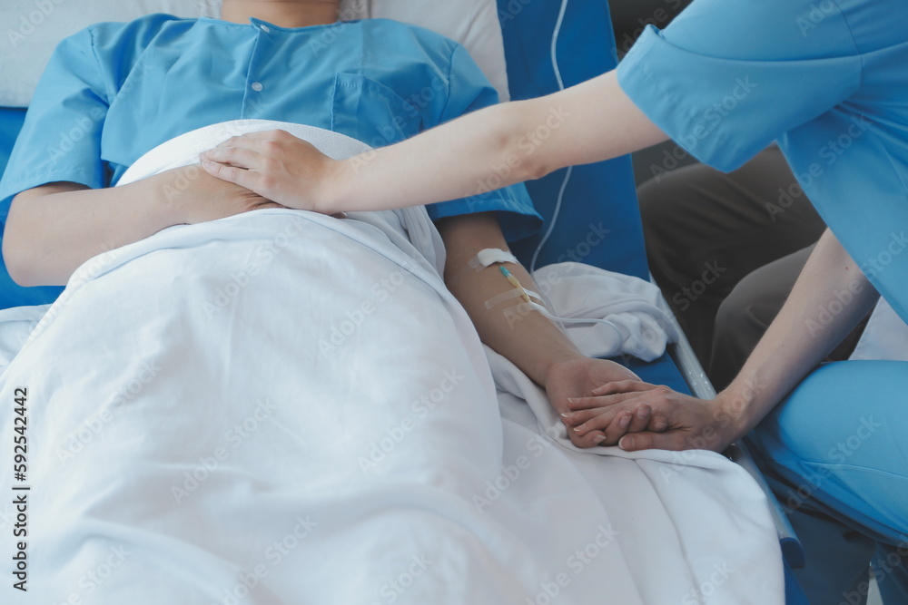 Injured patient showing doctor broken wrist and arm with bandage in hospital office or emergency room. Sprain, stress fracture or repetitive strain injury in hand. Nurse helping customer. First aid. Injured patient showing doctor broken wrist and arm with bandage in hospital office or emergency room. Sprain, stress fracture or repetitive strain injury in hand. Nurse helping customer. First aid.