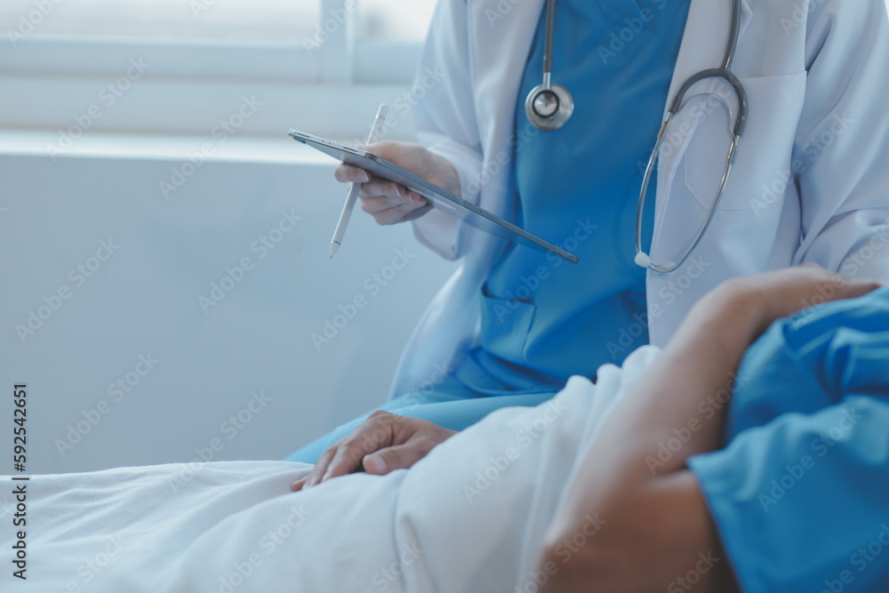 Injured patient showing doctor broken wrist and arm with bandage in hospital office or emergency room. Sprain, stress fracture or repetitive strain injury in hand. Nurse helping customer. First aid. Injured patient showing doctor broken wrist and arm with bandage in hospital office or emergency room. Sprain, stress fracture or repetitive strain injury in hand. Nurse helping customer. First aid.