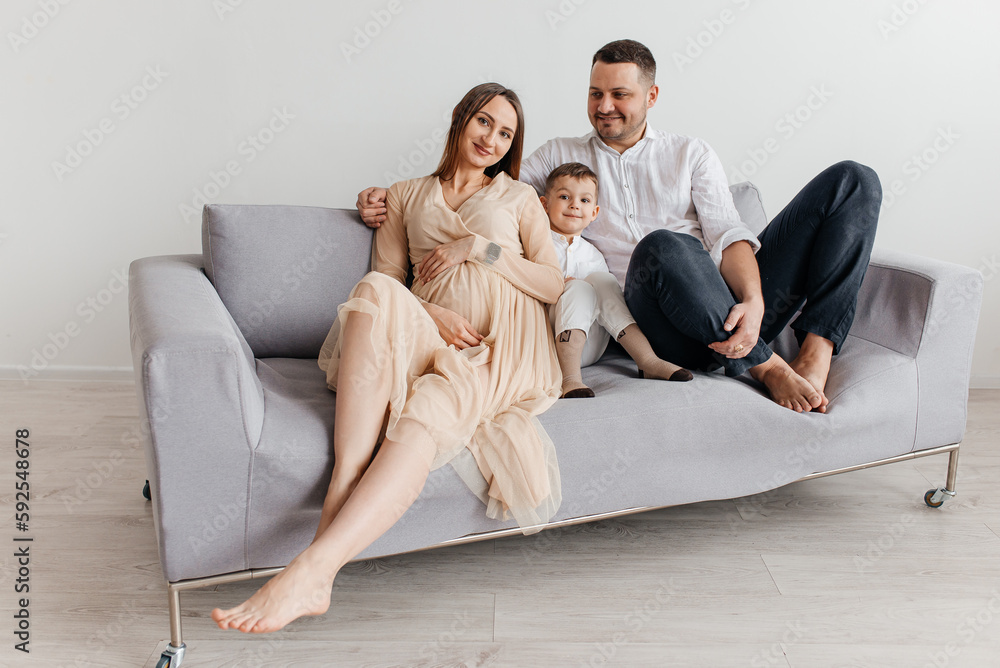 family, parenthood and people concept - happy mother, father with baby at home family, parenthood and people concept - happy mother, father with baby at home