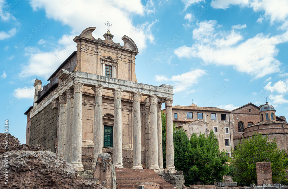 Ruins of the Temple of Antoninus and Faustina - the front view of the San Lorenzo in Miranda church built inside the antique temple at the Sacred Road in Roman Forum in Rome, Italy