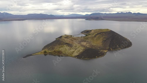 Sandey volcanic crater island in lake Thingvallavatn in the south of Iceland photo