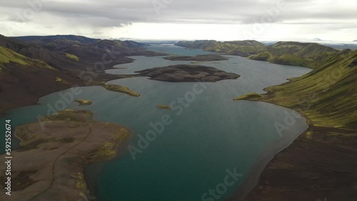 Langisjor lake in the central highlands of Iceland, with black sand deserts, moss covered mountains, glacial rivers and glaciers in the background photo