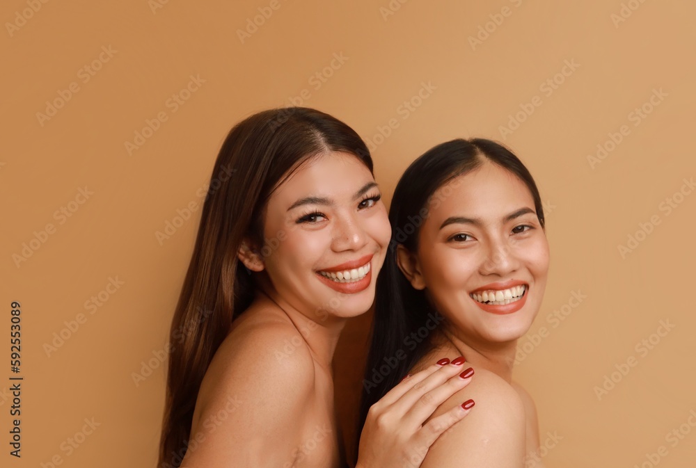 Portrait of beautiful Asian a women with natural makeup standing over beige background, copy space. Portrait of beautiful Asian a women with natural makeup standing over beige background, copy space.