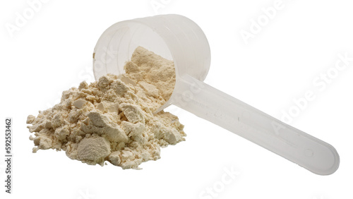 Whey protein powder in a measuring spoon isolated on white background.