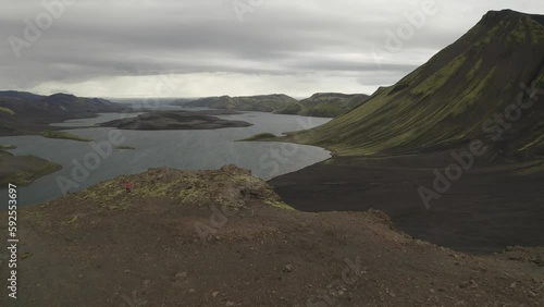 Langisjor lake in the central highlands of Iceland, with black sand deserts, moss covered mountains, glacial rivers and glaciers in the background photo