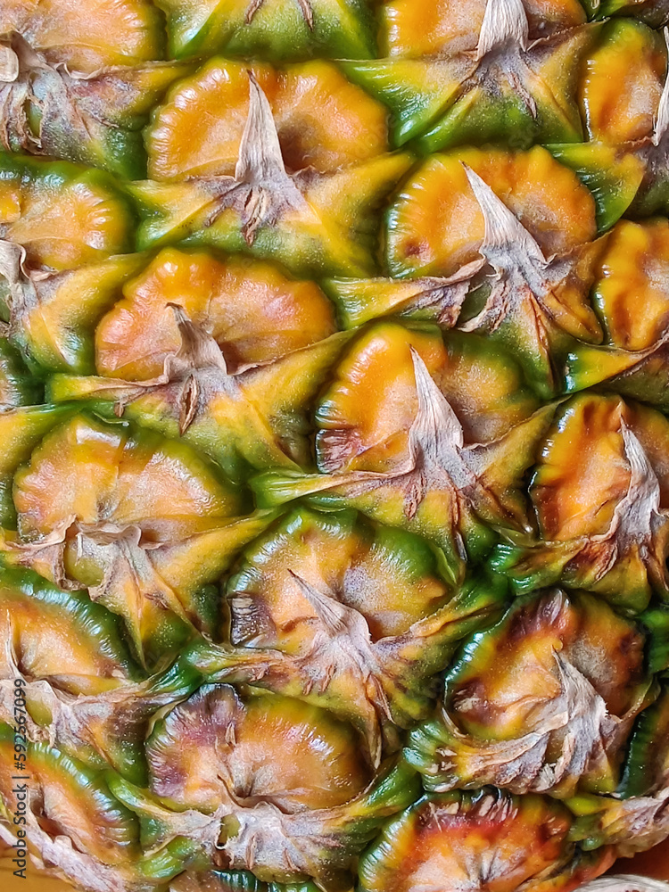 Part of ripe pineapple is close-up. Fragment of fresh delicious fruit. Selective focus. Part of ripe pineapple is close-up. Fragment of fresh delicious fruit. Selective focus.