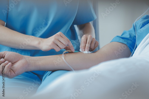 Injured patient showing doctor broken wrist and arm with bandage in hospital office or emergency room. Sprain  stress fracture or repetitive strain injury in hand. Nurse helping customer. First aid.
