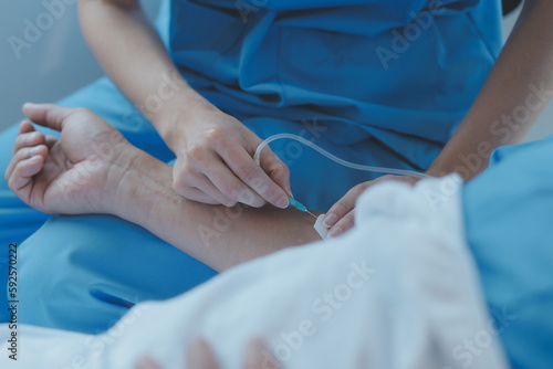 Injured patient showing doctor broken wrist and arm with bandage in hospital office or emergency room. Sprain  stress fracture or repetitive strain injury in hand. Nurse helping customer. First aid.