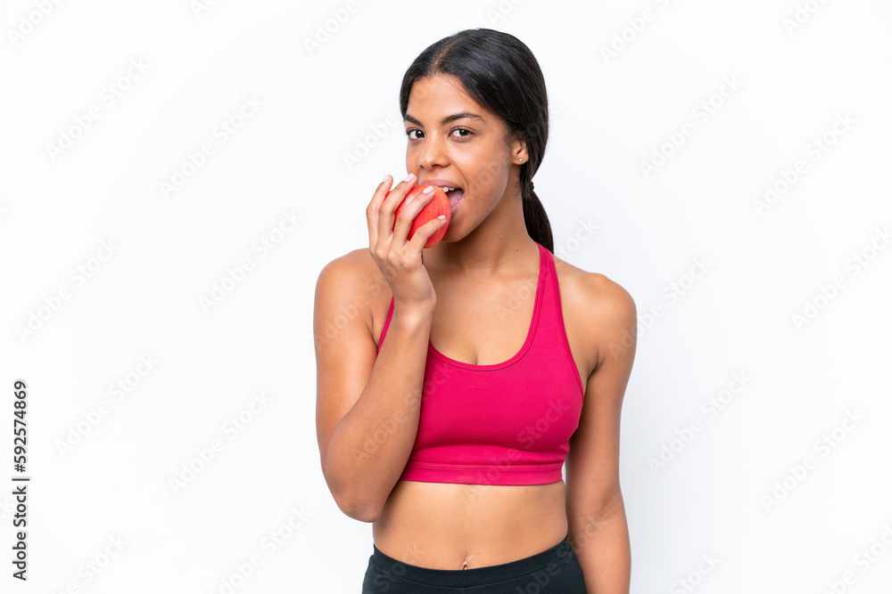 Young African american woman isolated on white background eating an apple Young African american woman isolated on white background eating an apple