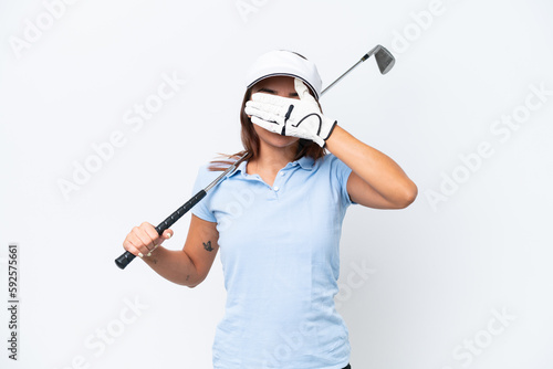 Young caucasian woman playing golf isolated on white background covering eyes by hands. Do not want to see something
