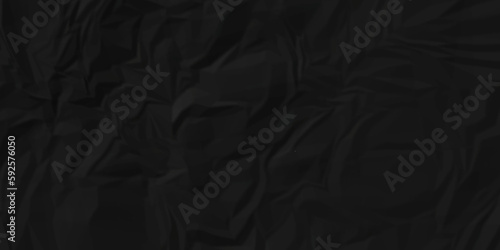 Black fabric texture and Crumpled black paper. Textured crumpled black paper background. 